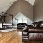 a living room with a couch and a bed.