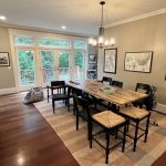 a dining room with a table and chairs.