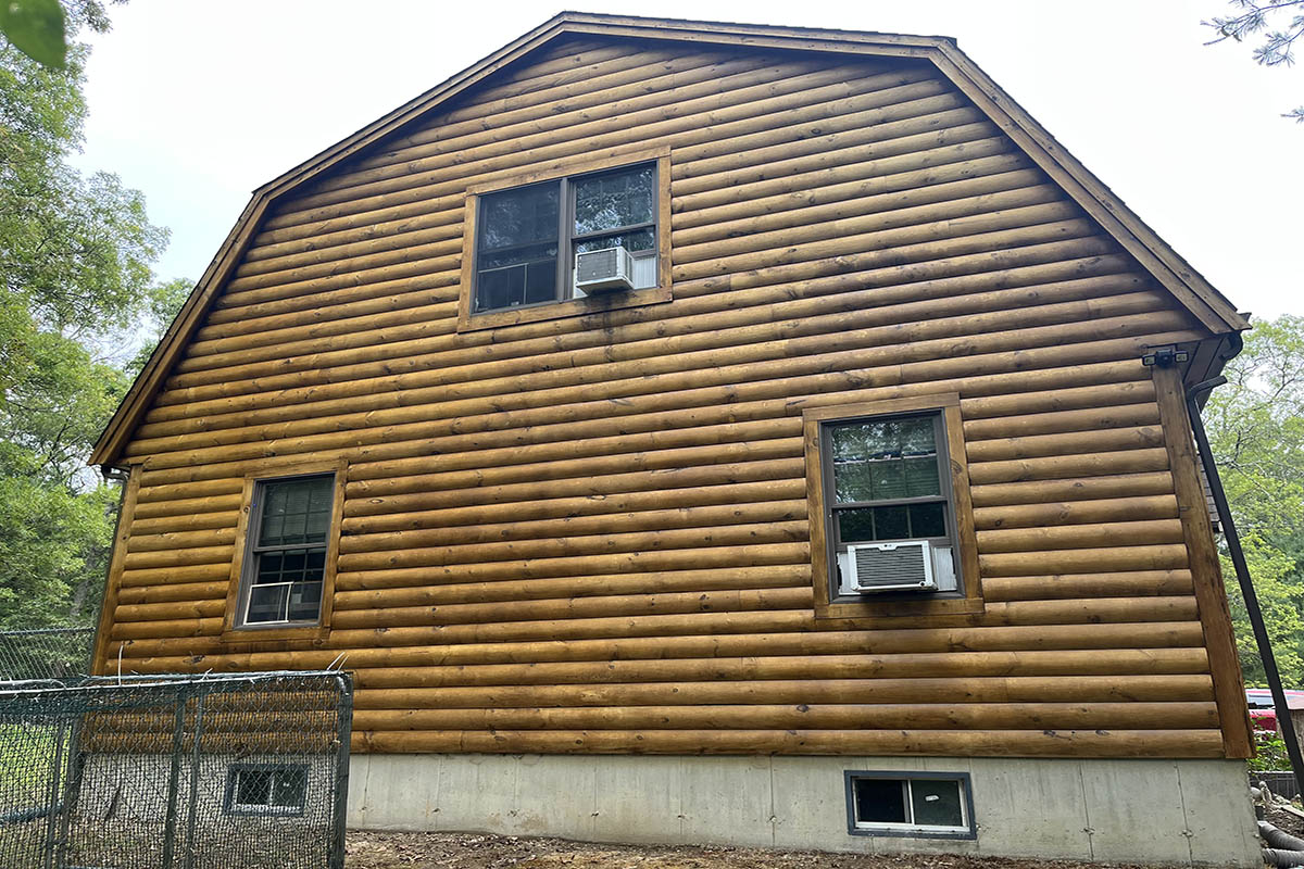 A log cabin with a window.