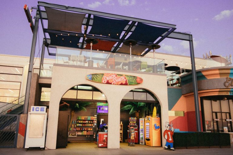 A commercial building with a sign on it for commercial painting contracts.