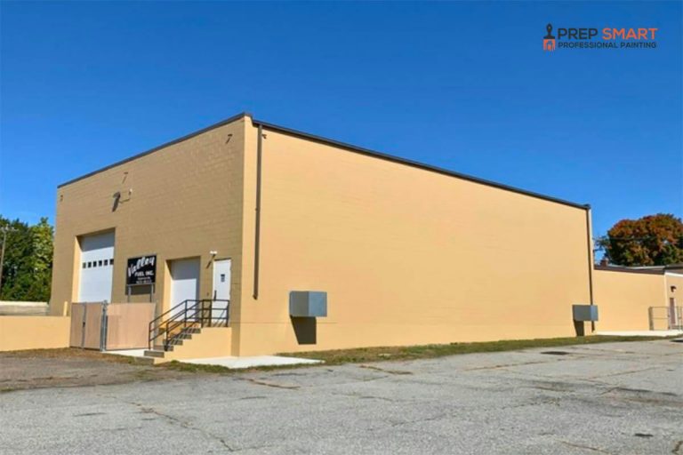 A building with a parking lot that may require Power Washing or Pressure Washing to clean its exterior surfaces.