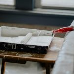 Paint brush on a white paint home interior