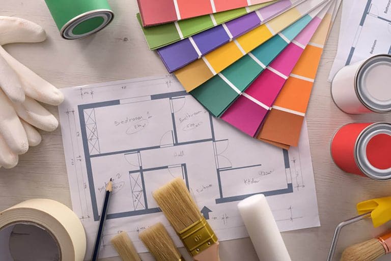 What to expect from an interior painting project, shown with paint color swatches, brushes, rollers, and a home floor plan during planning.