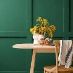 Freshly painted green paneled walls showing signs your walls are ready for a fresh coat of paint in a modern dining space