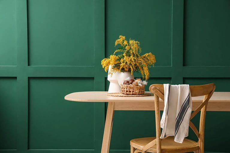 Freshly painted green paneled walls showing signs your walls are ready for a fresh coat of paint in a modern dining space