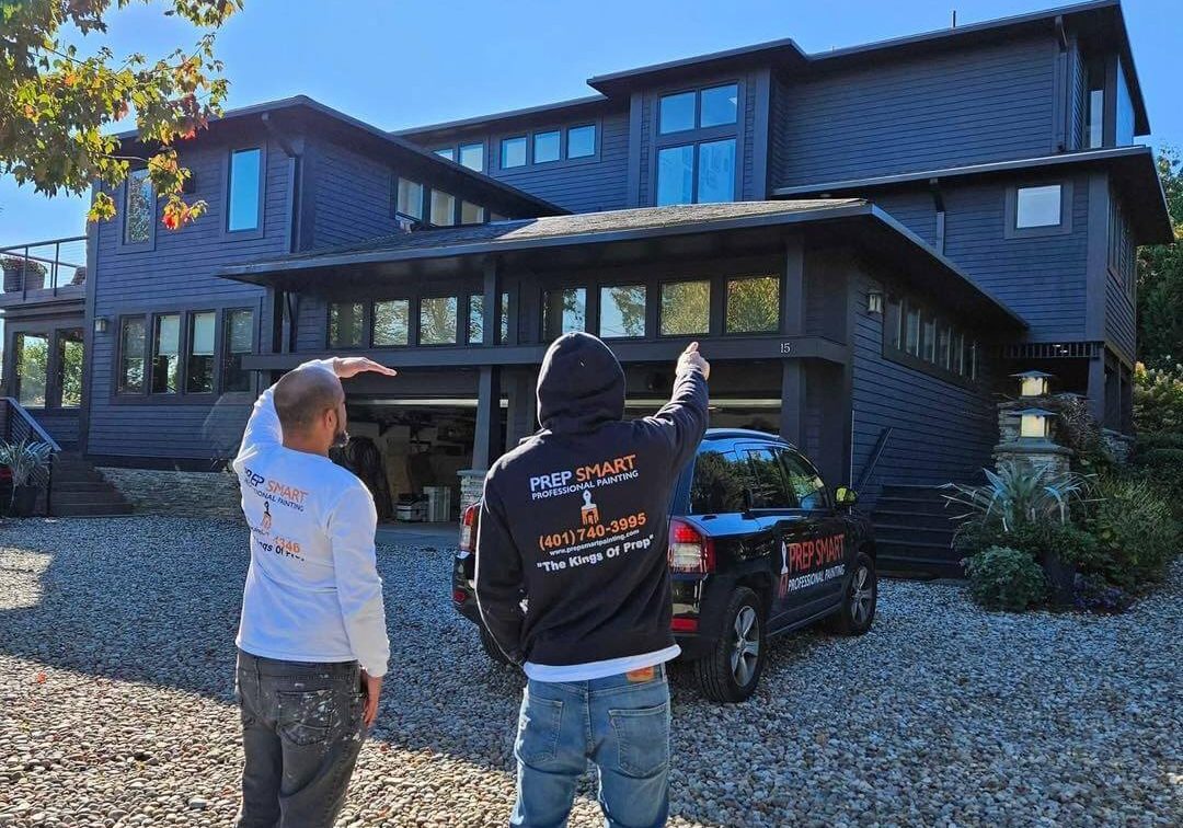 prep smart painting team looking at exterior of home